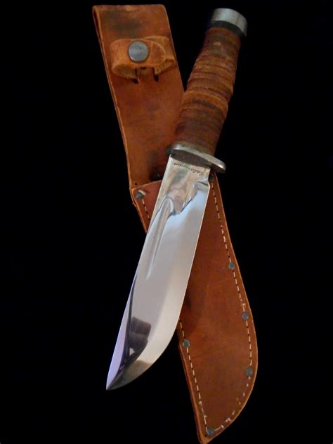 I restored a WWII military knife with a stacked leather handle. . Cattaraugus 225q quartermaster knife